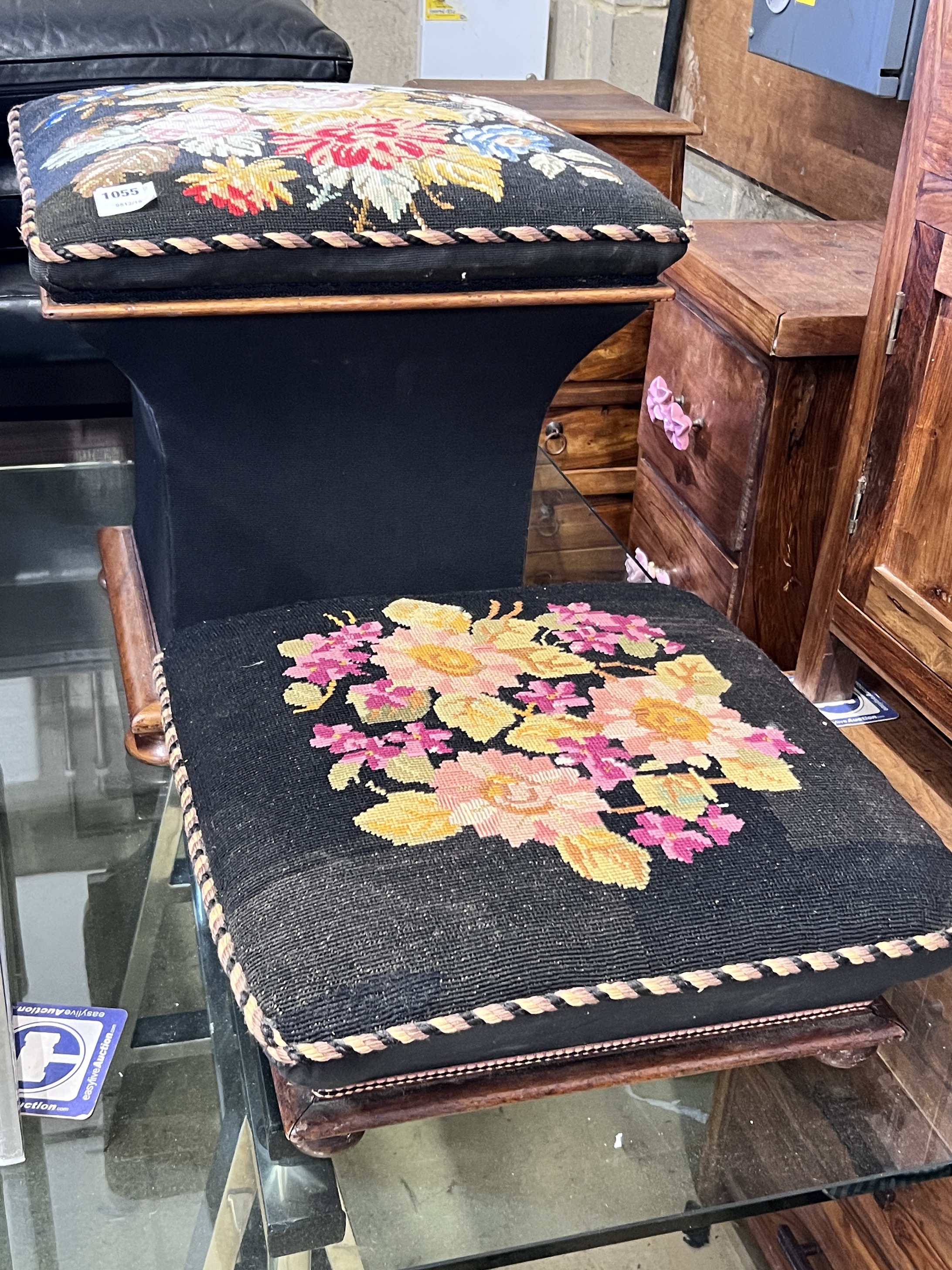 A Victorian ottoman stool with woolwork floral upholstery, width 48cm and a similar footstool, width 48cm